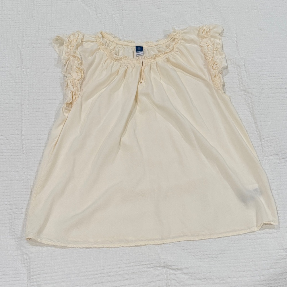 Cream Ruffled Sleeveless Blouse